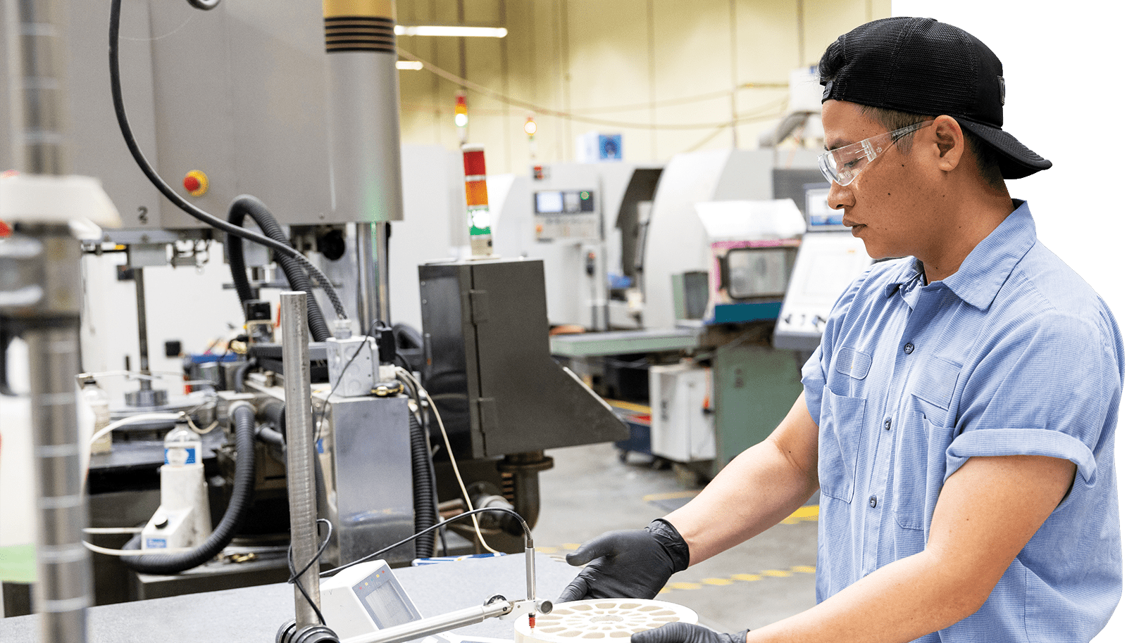 An employee working on a piece of a product