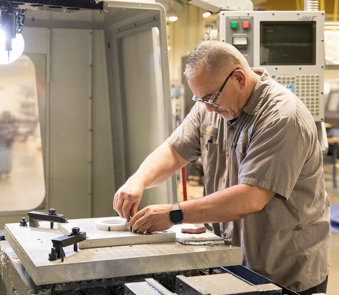 An employee working on a product