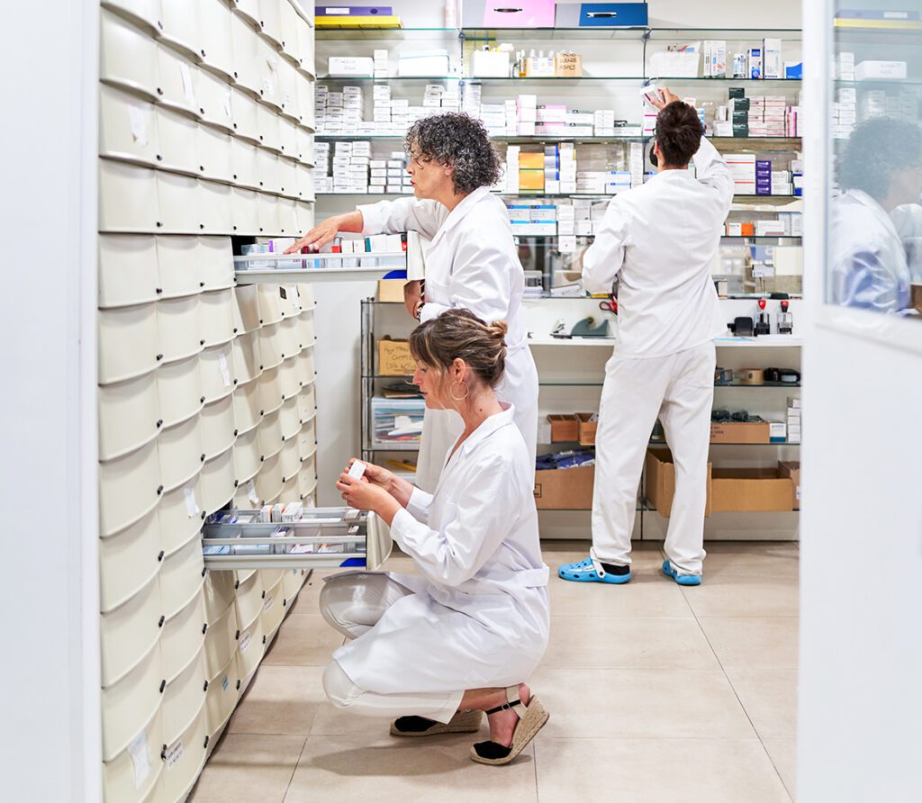 Three pharmacists in a pharmacy