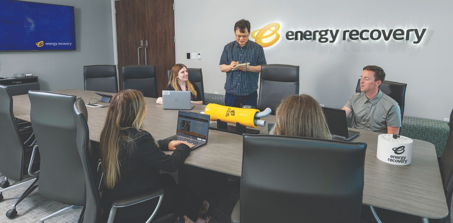 Energy recovery conference room with a prototype in the middle of the table.