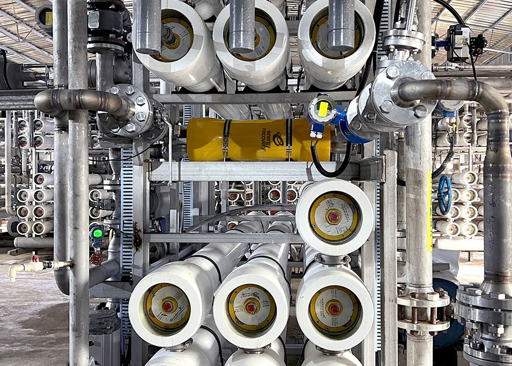 Industrial membrane filtration system with multiple pressure vessels, stainless steel piping, and instrumentation used for high-efficiency wastewater reuse.